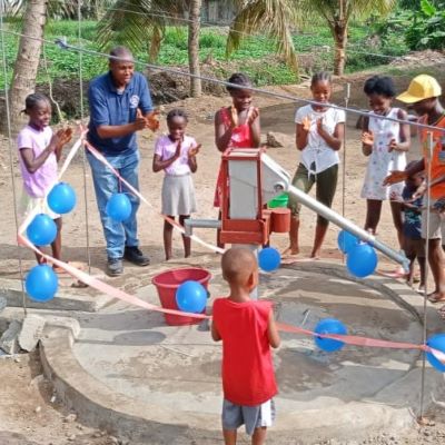 Community dedicating their new well