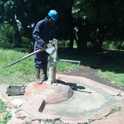 Wagunga village hand pump undergoing repair 