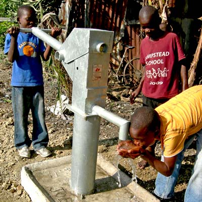 Children enjoying a drink of Safe Water