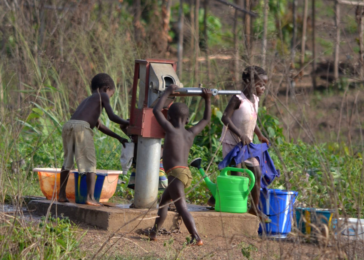 Children pumping safe water from new well!
