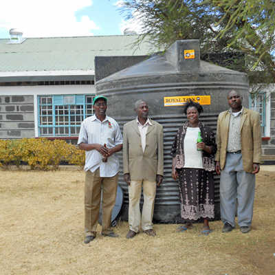 10,000 L. Tank in front of Church with Principle and Teachers