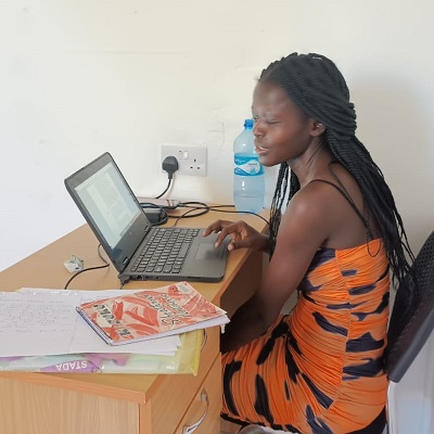 Lydia Otieno enjoys the efficiency of her new laptop