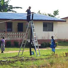 Volunteer Working on Worker Housing Permanent Lighting