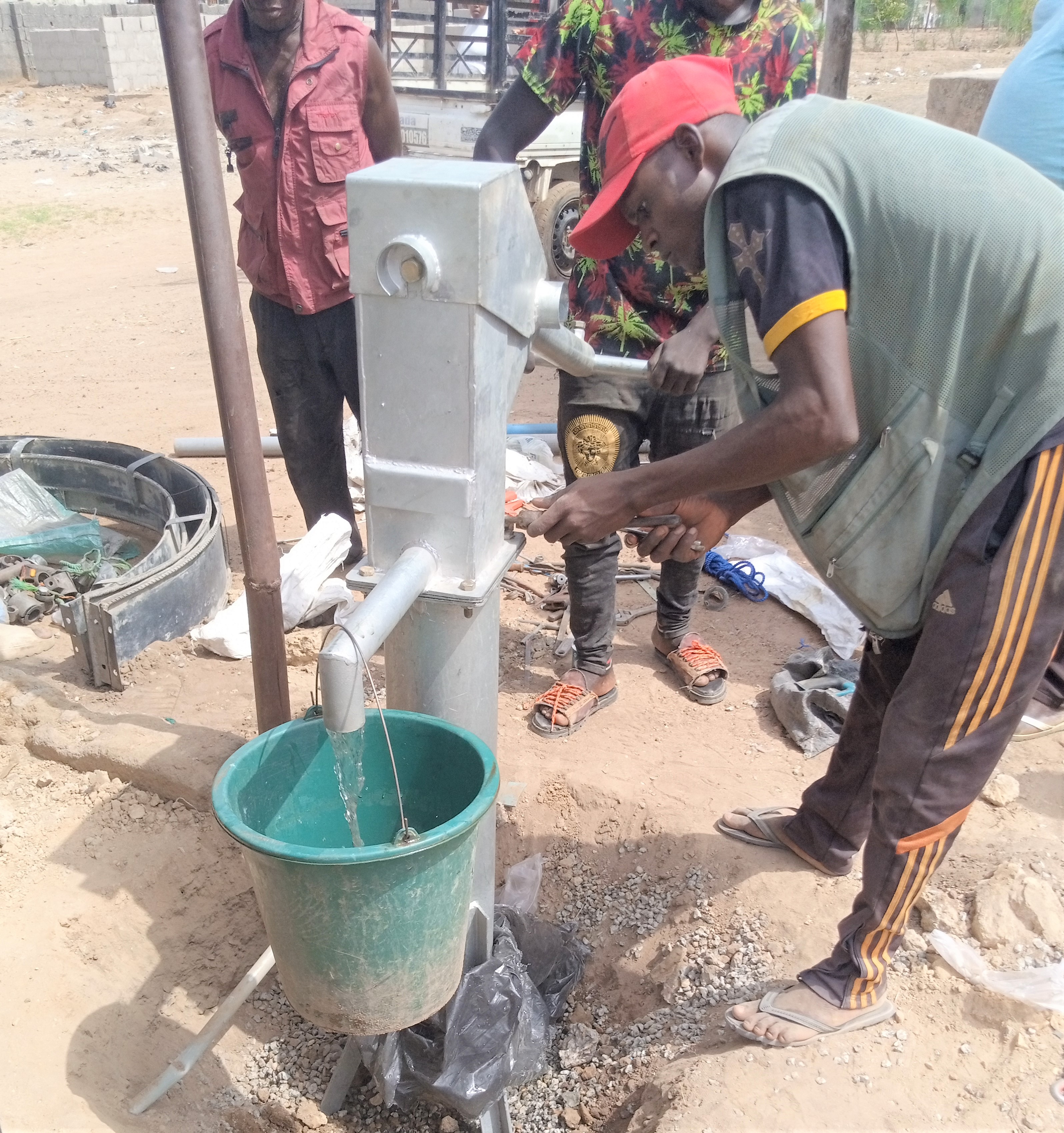 Yohanna installing a new pump.jpg 2 MB