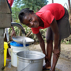 girl at well Haiti.jpg 112 KB