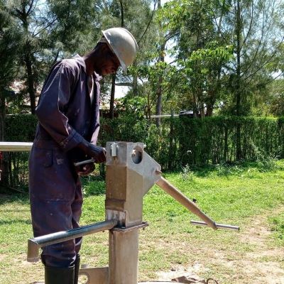 Village hand pump undergoing repairs