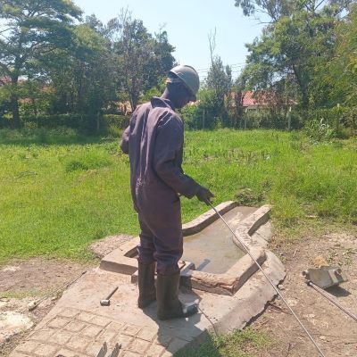 Community hand pump undergoing repairs 