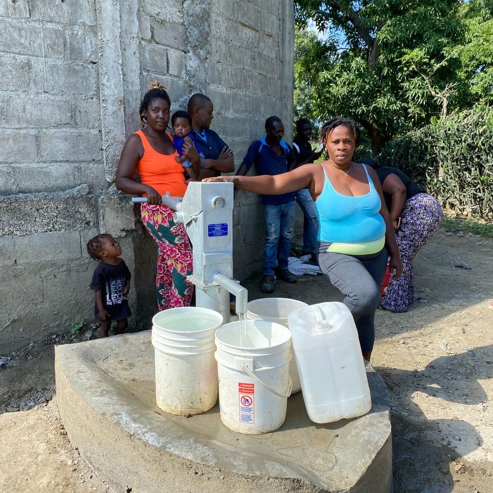Village women drawing water