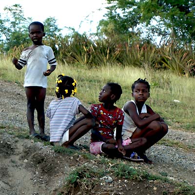 Village Children watching the Team Work