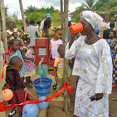 Enjoying a safe cup of Water from the New well