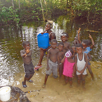 Child drinking from dirty drinking water source