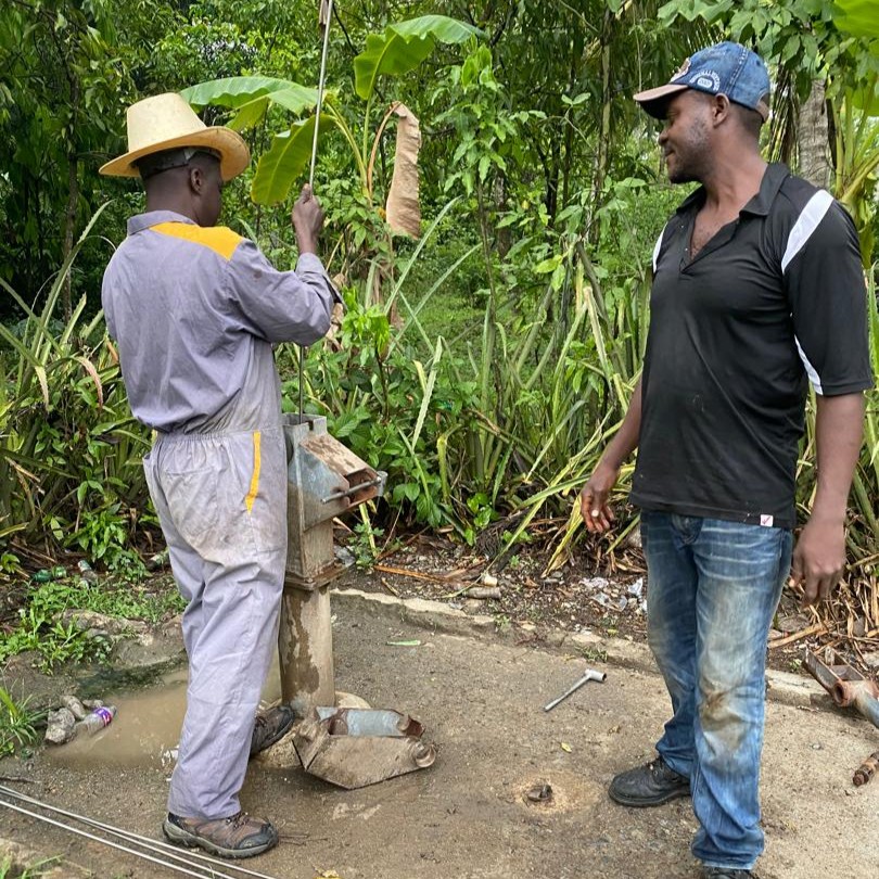 Team at work fixing pump
