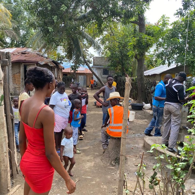 Villagers watching repair work