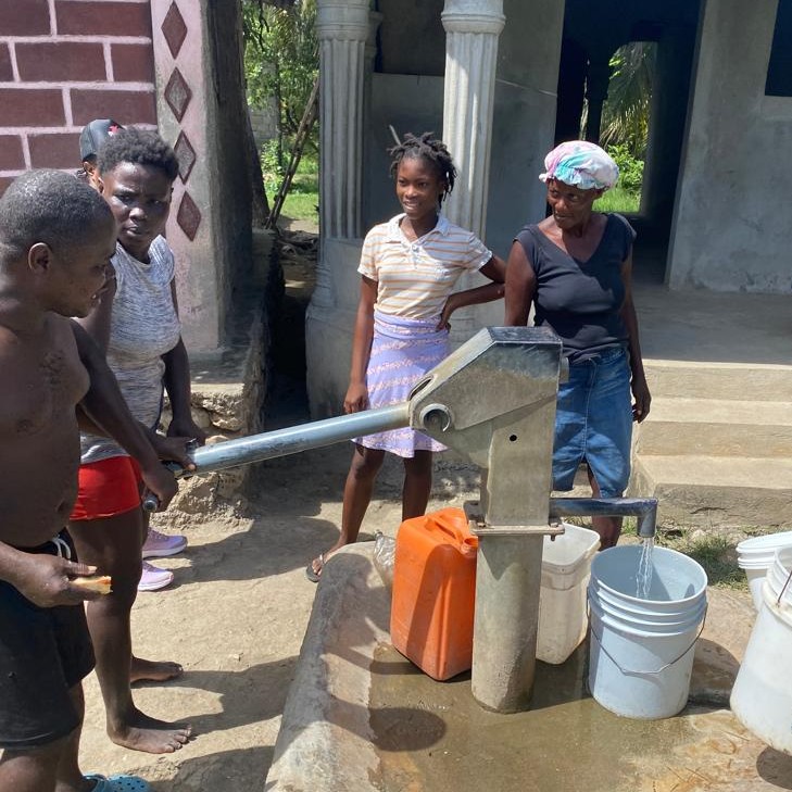 Drawing water from newly repaired well