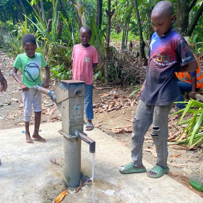 Children at the repaired pump