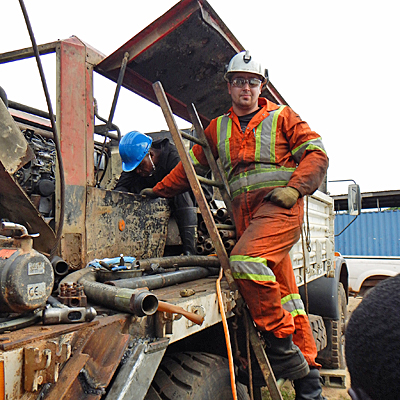 Volunteer training local mechanic how to install and maintain power unit