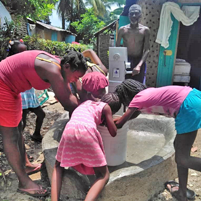 Excited children around the new well!