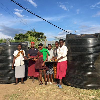 Group members around new tanks
