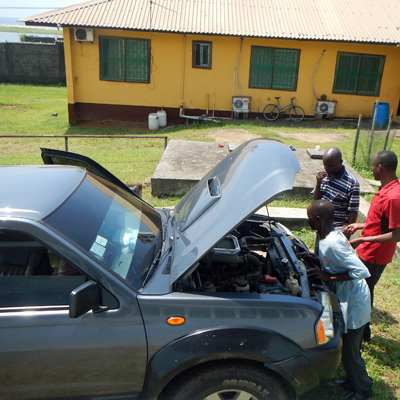 Mechanics looking at New Vehicle 