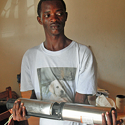 Lifewater driller being taught how to service the new pump