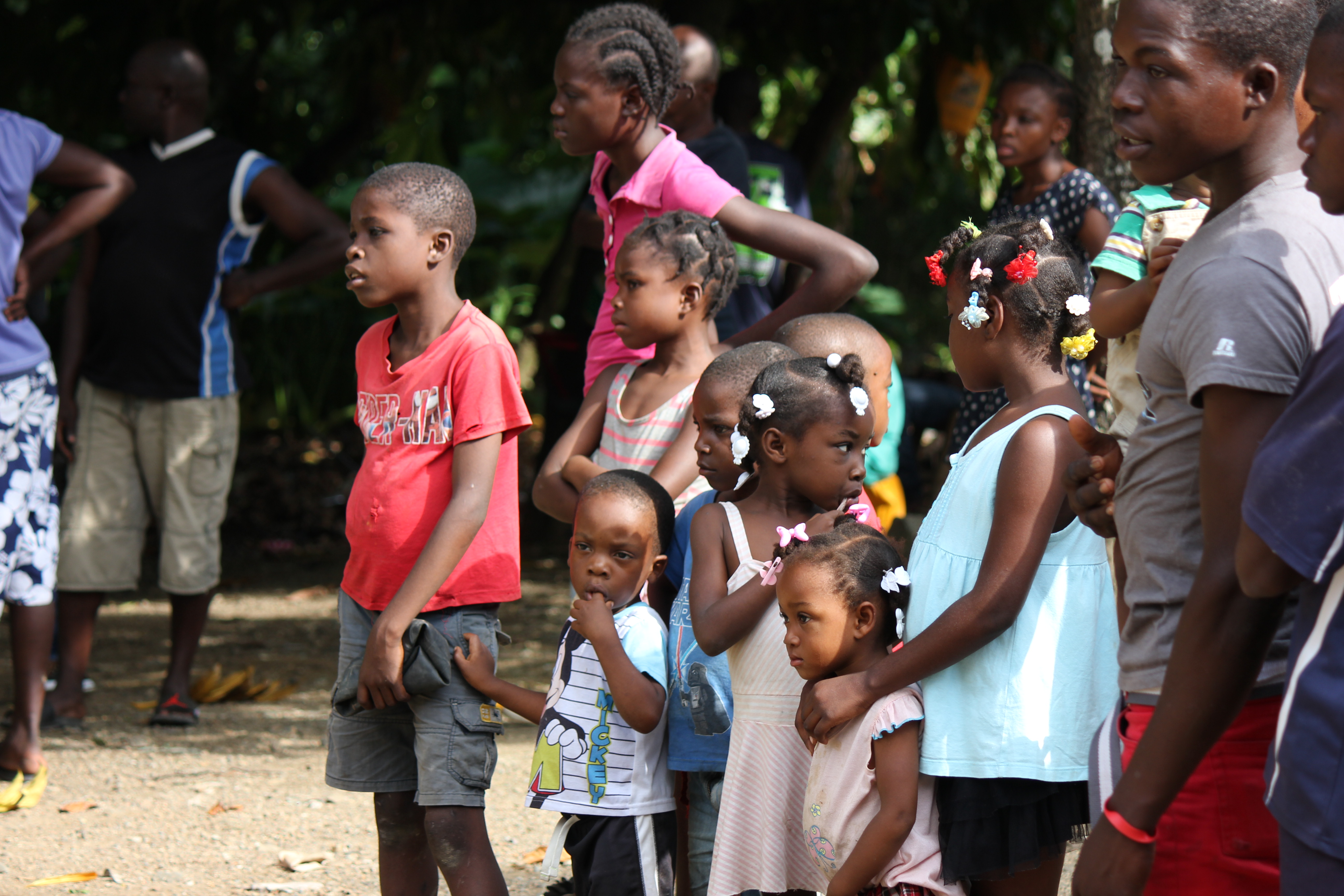 Village Children watching the well being drilled