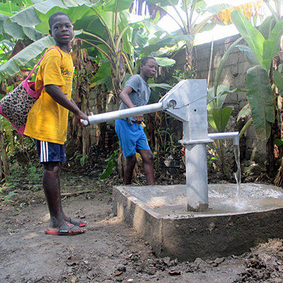 Children drawing Water from new Well