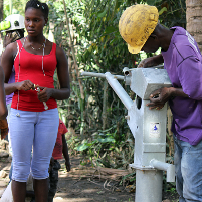 Villagers waiting for Pump to be completed