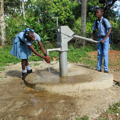 School girl washing hands