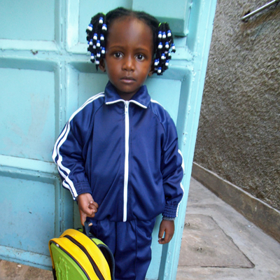 One of the students at the school waiting to wash her hands