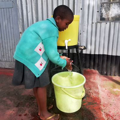 Orphan at New hand washing station