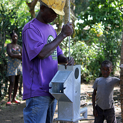 Faden repairing a village well
