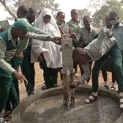Children drawing from the new pump