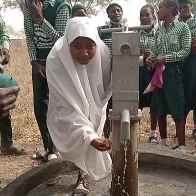 Thankful school children benefitting from safe water