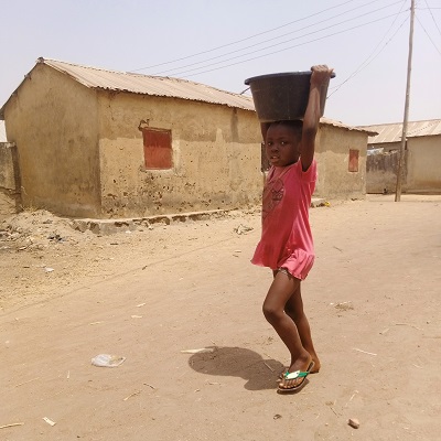 Child hauling water