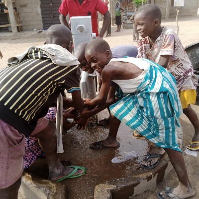 Children drawing water from new well