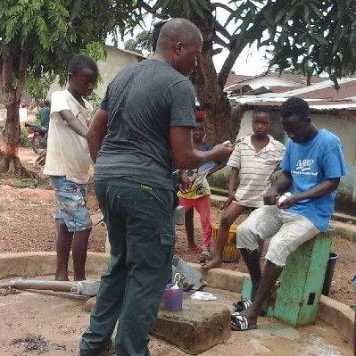 taking time to teach local caretaker