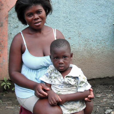 Mother and Child happy to have their village well repaired