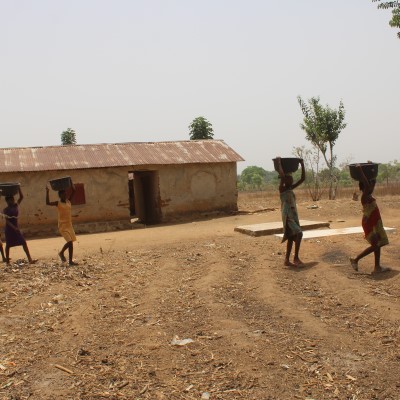 Community Helping bring Sand and water for Pump Pad