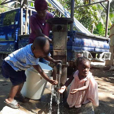 Children by newly repaired well