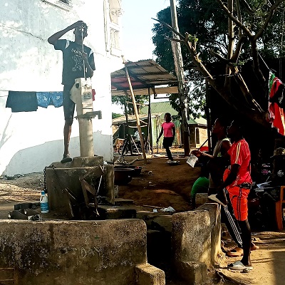 The broken hand-pump undergoing repair