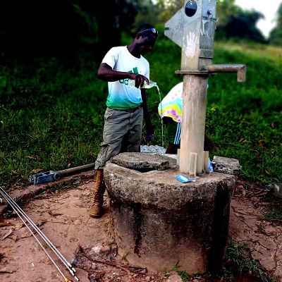 Pump repair team treating water before use 