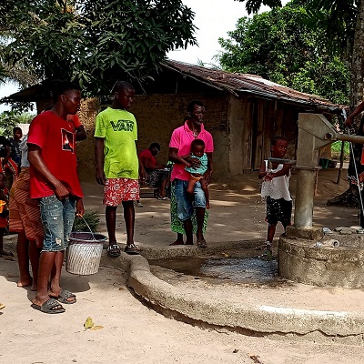 Zay Zay Community members queuing to get clean water from the hand-pump