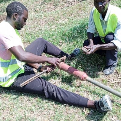 Hand pump repair team at work