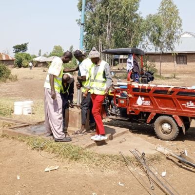 Hand pump repair team at work