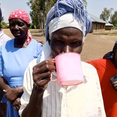 Villager enjoying clean and drinking water