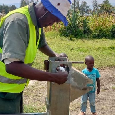 Village hand pump undergoing repair