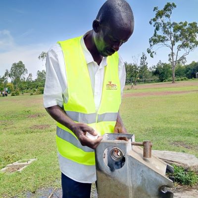 Hand pump repair in progress