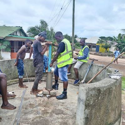 Hand pump repair team at work