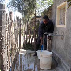 Villager Drawing Water
