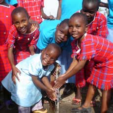 School Childrenat Water Outlet
